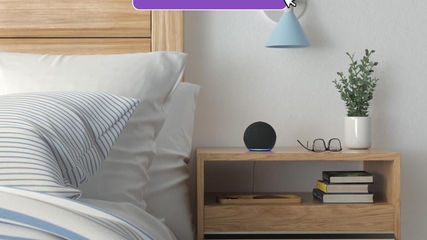 Amazon's Echo Dot smart speaker sits on a bedside table. 