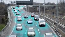 Photo illustration of autonomous self-driving cars using artificial intelligence to drive on a highway. They are connected through a network.