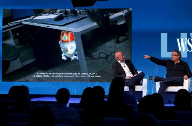 Rony Abovitz, founder president and CEO of Magic Leap (R) unveils a view of his companies augmented reality with Rio Caraeff, chief content officer, at the Wall Street Journal Digital Live ( WSJDLive ) conference at the Montage hotel in Laguna Beach, California  October 20, 2015.      REUTERS/Mike Blake