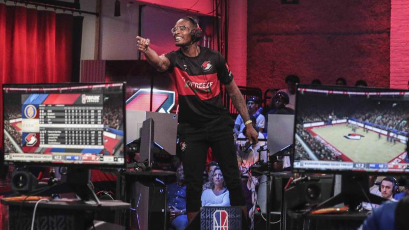 Andron "Lavish Phenom" Thomas, from Brooklyn borough of New York, who plays for Blazers Gaming, taunts an opponent during the NBA 2k League (NBA2KL) professional esports playoffs, Wednesday, July 24, 2019, in Queens borough of New York. The teams kicked off day one of the NBA2KL playoffs with Blazers on the losing 67-45. (AP Photo/Bebeto Matthews)