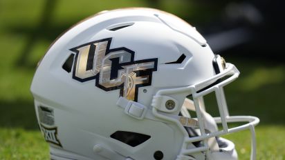 Getty Images - ORLANDO, FL - OCTOBER 28: a UCF Knights helmet rests near the sidelines during the game between the West Virginia Mountaineers and the UCF Knights on Saturday, October 28, 2023 at FBC Mortgage Stadium in Orlando, Fla. (Photo by Peter Joneleit/Icon Sportswire via Getty Images)