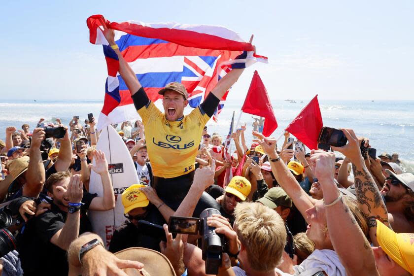 Photos: John John Florence and Caitlin Simmers crowned at surfing world championships