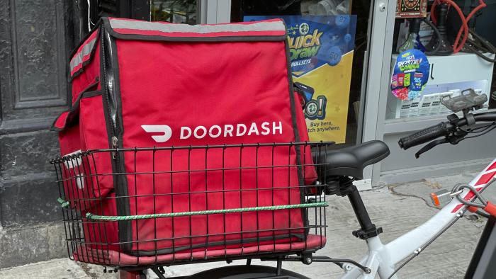 Photo by: STRF/STAR MAX/IPx 2021 10/9/21 DoorDash and other food delivery companies will have to disclose all prices and give workers all tips under new California law. Here, DoorDash delivery bike is seen in Manhattan.