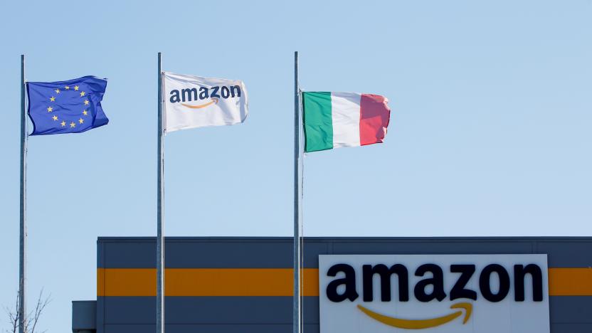 Flags flutter outside a distribution centre, during a strike at Amazon's logistics operations in Italy, in Passo Corese, Italy March 22, 2021. REUTERS/Remo Casilli