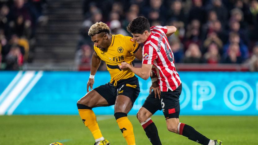 BRENTFORD, ENGLAND - JANUARY 22: Adama Traore of Wolverhampton Wanderers and Christian Norgaard of Brentford in action during the Premier League match between Brentford and Wolverhampton Wanderers at Brentford Community Stadium on January 22, 2022 in Brentford, United Kingdom. (Photo by Sebastian Frej/MB Media/Getty Images)