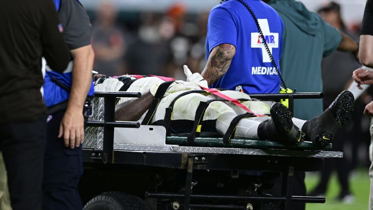 Philadelphia Eagles players carted off after suffering neck injuries have  'movement in all extremities'