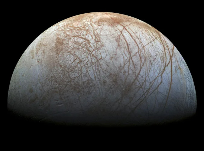 A new mosaic made from images taken by NASA's Galileo spacecraft in the late 1990's is shown of the surface of Jupiter's icy moon, Europa, as it looms large in this newly-reprocessed, higher resolution color view in this handout provided by NASA November 24, 2014. This newer version was created from images assembled into a realistic color view of the surface that approximates how Europa would appear to the human eye. NASA/JPL-Caltech/SETI Institue/Handout via Reuters   (OUTERSPACE - Tags: SCIENCE TECHNOLOGY)ATTENTION EDITORS - FOR EDITORIAL USE ONLY. NOT FOR SALE FOR MARKETING OR ADVERTISING CAMPAIGNS. THIS PICTURE WAS PROVIDED BY A THIRD PARTY. REUTERS IS UNABLE TO INDEPENDENTLY VERIFY THE AUTHENTICITY, CONTENT, LOCATION OR DATE OF THIS IMAGE. THIS PICTURE IS DISTRIBUTED EXACTLY AS RECEIVED BY REUTERS, AS A SERVICE TO CLIENTS