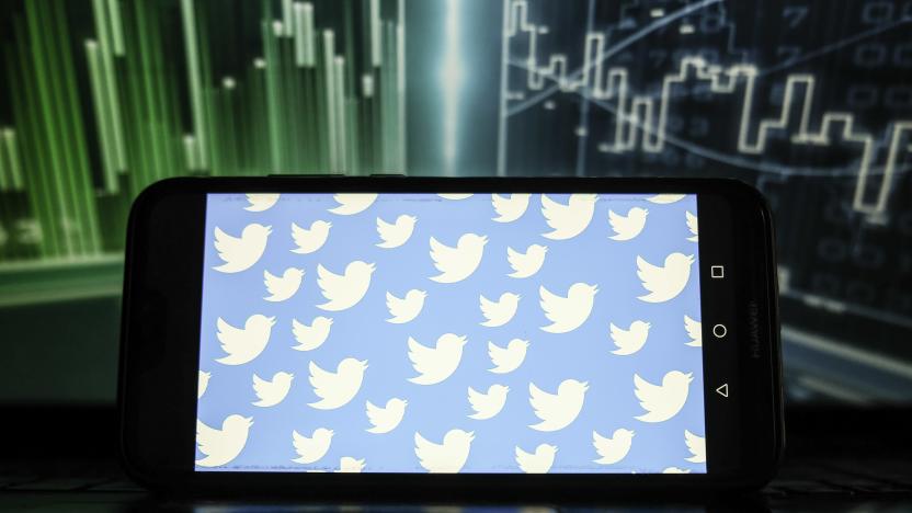 POLAND - 2022/01/21: In this photo illustration, Twitter logos displayed on a smartphone with a stock market graphic in the background. (Photo Illustration by Omar Marques/SOPA Images/LightRocket via Getty Images)