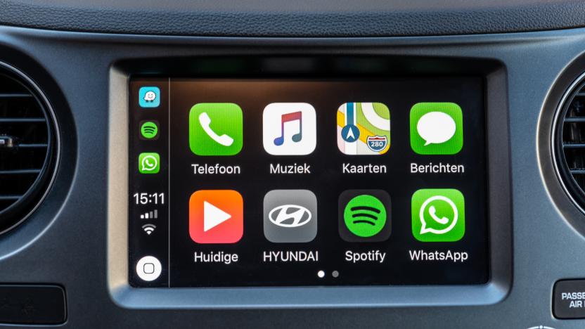 Alkmaar, The Netherlands - September 26, 2018: Apple CarPlay main screen in modern car dashboard. CarPlay is an Apple standard that enables a car radio or head unit to be a display and controller for an iPhone.