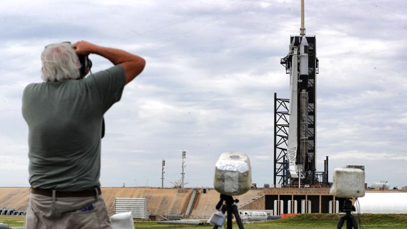 News photographers set up remote-fire cameras at Launch Complex 39-A as the SpaceX Falcon 9 rocket sits on the launch pad carrying the CRS-21 Cargo Dragon 2 capsule, Friday, Dec. 4, 2020. Scheduled to launch Saturday morning, it is the first flight of the spacecraft in the second phase of the Commercial Resupply Service to the International Space Station, contracted by NASA.  (Joe Burbank/Orlando Sentinel/Tribune News Service via Getty Images)