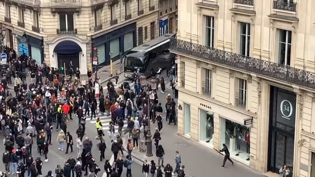 Paris protests: Scenes of destruction on Champs Elysées