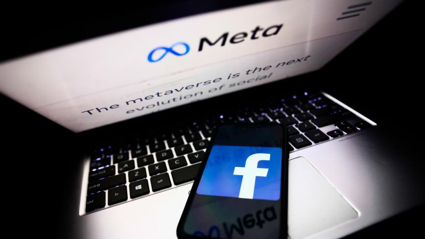 Meta website displayed on a laptop screen and Facebook app logo displayed on a phone screen are seen in this illustration photo taken in Krakow, Poland on October 28, 2021. Mark Zuckerberg announced during Facebook Connect event that the new name of Facebook company will be Meta. (Photo by Jakub Porzycki/NurPhoto via Getty Images)
