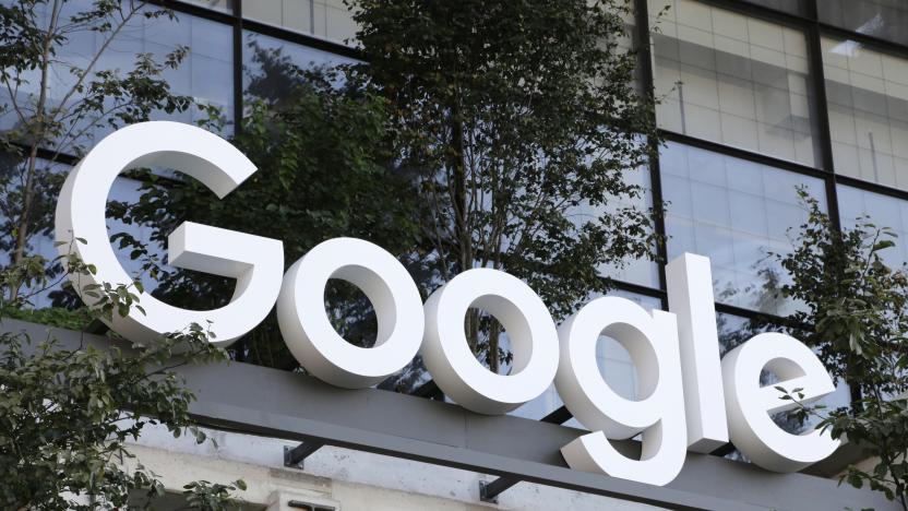 FILE - A Google sign hangs over an entrance to the company's new building, Sept. 6, 2023, in New York. Google has laid off hundreds of employees working on its hardware, voice assistance and engineering teams as part of cost-cutting measures. (AP Photo/Peter Morgan, File)