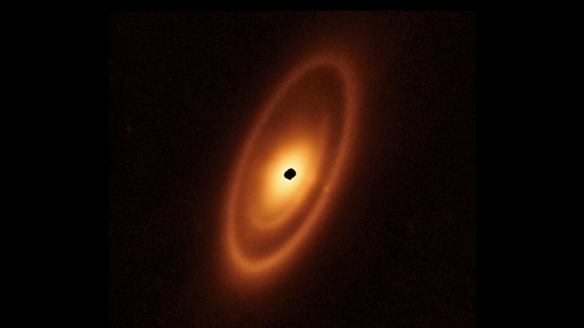 This image of the dusty debris disk surrounding the young star Fomalhaut is from Webb’s Mid-Infrared Instrument (MIRI). It reveals three nested belts extending out to 14 billion miles (23 billion kilometers) from the star. The inner belts – which had never been seen before – were revealed by Webb for the first time.