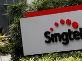 Singtel falls up to 3% after $2.3 billion impairment