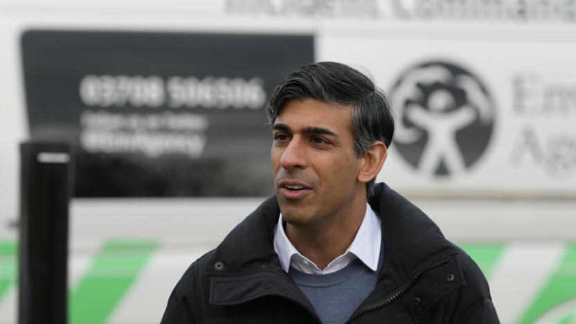 Britain's Prime Minister Rishi Sunak speaks to members of the Environment Agency as he looks at flood defences during a visit to Oxford, England, Sunday, Jan. 7, 2024. Britain was hit by heavy rainfall last week following storm Henk, which led to flooding in parts of the UK. (AP Photo/Frank Augstein, Pool)