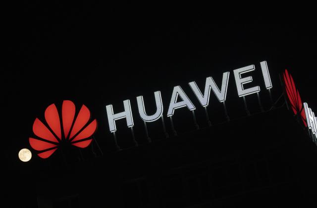 The Huawei logo is seen atop a buildin in central Warsaw, Poland on April 8, 2020. Chinese Huawei is the largest telecommunications company in the world and the second largest mobile phone manufacturer in the world after Samsung. In January 2019 a Huawei employee in Poland had been arrested on charges of espionage at the local offices of the company in Warsaw. Huawei says it has won a quarter of all 5G contracts all around the world despite worries of security leaks involving &quot;backdoors&quot;. (Photo by Jaap Arriens/NurPhoto via Getty Images)