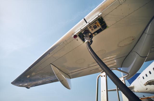 Ground service before flight. Refueling of airplane at airport.