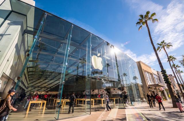 Santa Monica, USA - December 23, 2015: Apple Store on Third Street Promenade with people shopping inside and sightseeing outside on famous shopping street in Santa Monica downtown decorated for Xmas holidays.