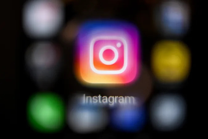 A photo taken on March 14, 2022, shows the US social network Instagram logo on a smartphone screen in Moscow. - Instagram was inaccessible in Russia on March 14 after Moscow accused its parent company Meta of allowing calls for violence against Russians, including the military, on its platforms. (Photo by AFP) (Photo by -/AFP via Getty Images)