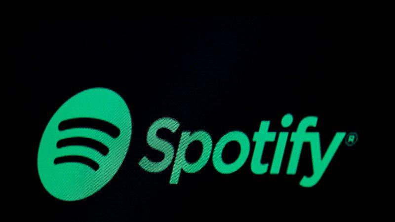 The Spotify logo is displayed on a screen on the floor of the NYSE in New York