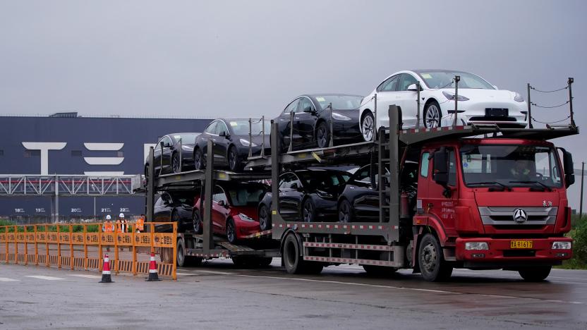 A truck transports new Tesla cars at its factory in Shanghai, China May 13, 2021. REUTERS/Aly Song