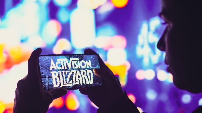 BRAZIL - 2022/06/01: In this photo illustration, a silhouetted woman holds a smartphone with the Activision Blizzard, Inc. logo displayed on the screen. (Photo Illustration by Rafael Henrique/SOPA Images/LightRocket via Getty Images)