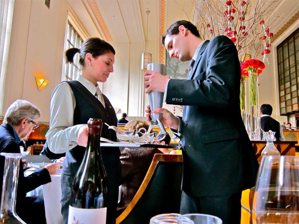 waitress serving wine