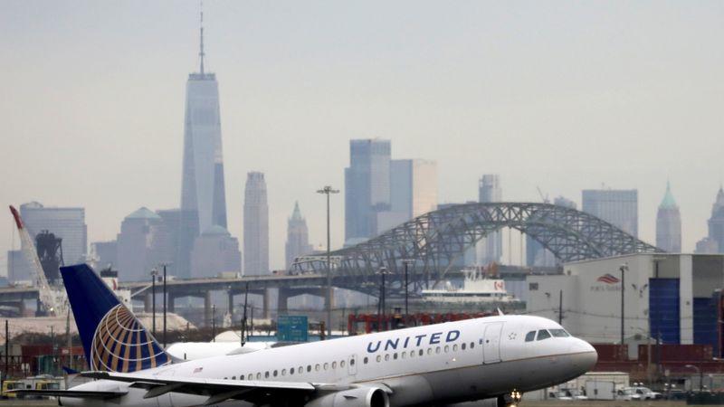 FILE PHOTO: FILE PHOTO: A United Airlines passenger jet takes off with New York City as a backdrop