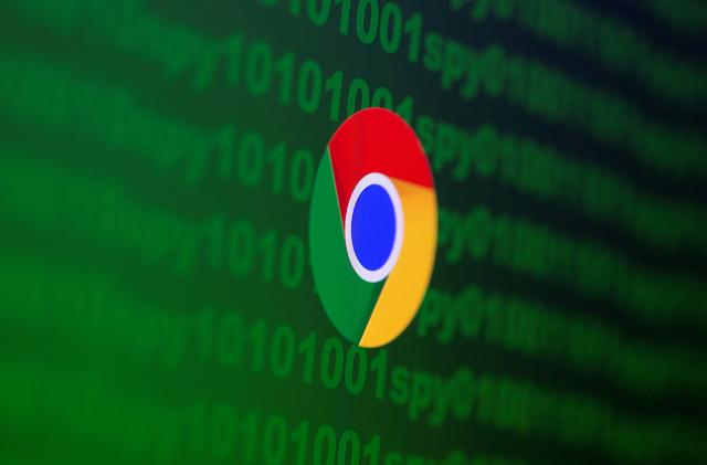 Google Chrome logo is seen near cyber code and words "spy"  in this illustration picture taken June 18, 2020. REUTERS/Dado Ruvic/Illustration