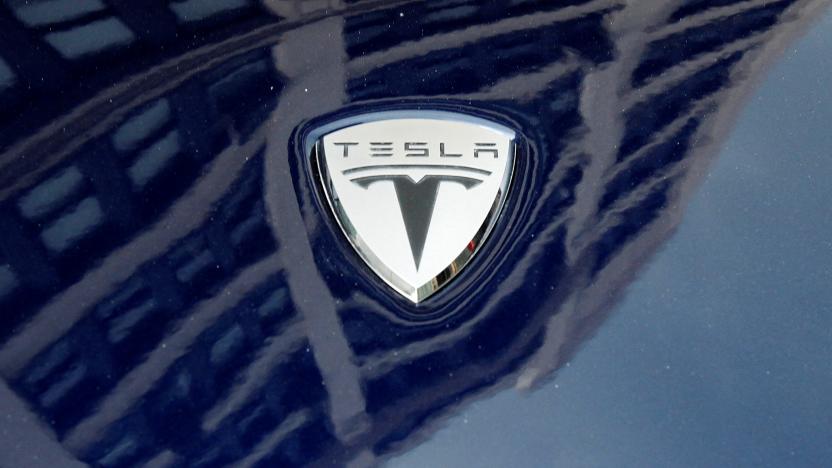A logo of Tesla Motors on an electric car model is seen outside a showroom in New York June 28, 2010.   REUTERS/Shannon Stapleton