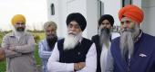 Balwinder Singh, center, and other members of the local Sikh community discuss the mass shooting in which four Sikhs died in Indianapolis last week. (New York Times)
