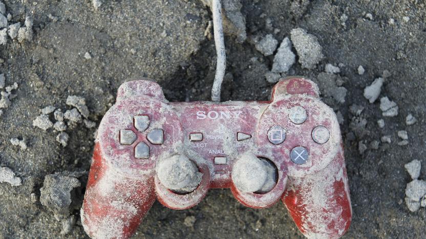 A Sony playstation controller is seen at an area that was devastated by last week's earthquake and tsunami, in Kesennuma, north Japan, March 19, 2011. REUTERS/Kim Kyung-Hoon (JAPAN - Tags: DISASTER SOCIETY)