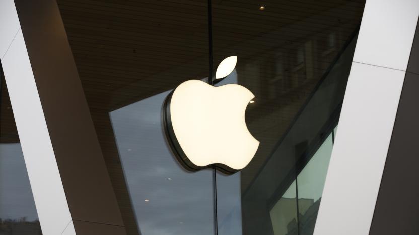 FILE - An Apple logo adorns the facade of the downtown Brooklyn Apple store on March 14, 2020, in New York. Apple became the first publicly traded company to close a trading day with a $3 trillion market value, marking another milestone for a technology juggernaut that has reshaped society with a line-up of products that churn out eye-popping profits. (AP Photo/Kathy Willens, File)