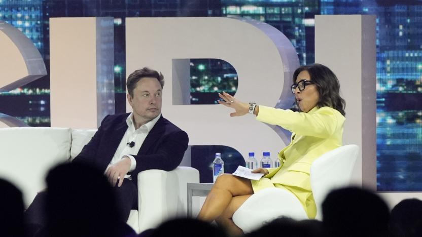 FILE - Twitter CEO Elon Musk, center, speaks with Linda Yaccarino, chairman of global advertising and partnerships for NBC, at the POSSIBLE marketing conference, Tuesday, April 18, 2023, in Miami Beach, Fla. Musk announced Friday, May 12, 2023, that he's hiring Yaccarino to be the new CEO of San Francisco-based Twitter, which is now called X Corp. (AP Photo/Rebecca Blackwell, File)