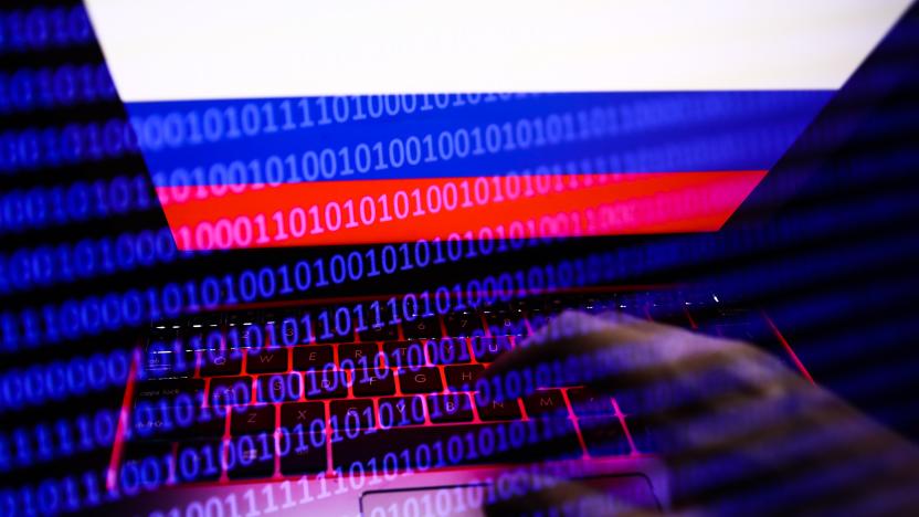 Russian flag displayed on a laptop screen and binary code code displayed on a screen are seen in this multiple exposure illustration photo taken in Krakow, Poland on February 16, 2022. (Photo illustration by Jakub Porzycki/NurPhoto via Getty Images)