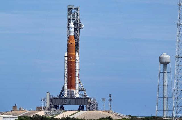 NASA's next-generation moon rocket, the Space Launch System (SLS), with the Orion crew capsule perched on top, stands on launch complex 39B one day after an engine-cooling problem forced NASA to delay the debut test launch at Cape Canaveral, Florida, U.S. August 30, 2022.  REUTERS/Steve Nesius