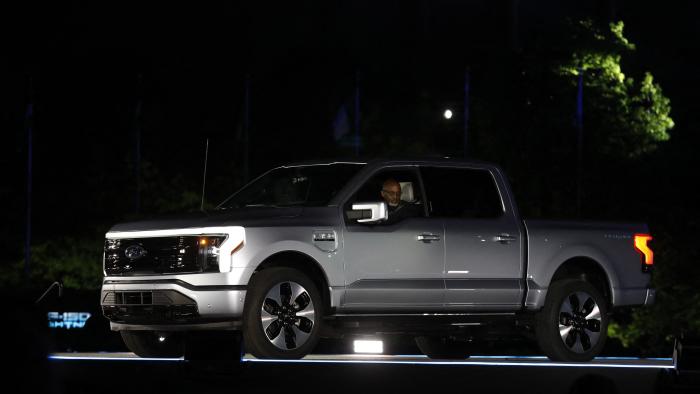 Ford Motor Company' unveils their new electric F-150 Lightning outside of their headquarters in Dearborn, Michigan on May 19, 2021. - One day after winning an enthusiastic endorsement from President Joe Biden, Ford will officially preview the all-electric version of its best-selling F-150 truck on May 19, 2021. The battery-powered Ford F-150 "Lightning" is part of the US auto giant's $22 billion campaign to ramp up its electric vehicle offerings by 2025. (Photo by JEFF KOWALSKY / AFP) (Photo by JEFF KOWALSKY/AFP via Getty Images)