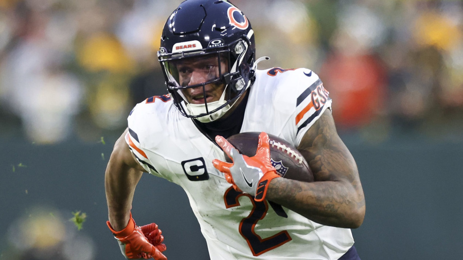 Getty Images - Chicago Bears wide receiver DJ Moore runs with the ball after receiving a pass in the second quarter against the Green Bay Packers at Lambeau Field on Sunday, Jan. 7, 2024, in Green Bay, Wisconsin. (Eileen T. Meslar/Chicago Tribune/Tribune News Service via Getty Images)