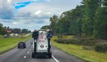 A truck with the T-Mobile logo on the road.