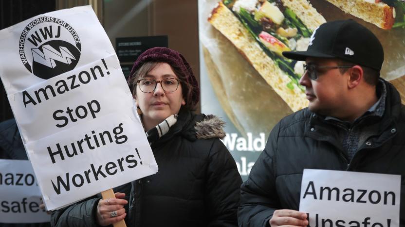 CHICAGO, ILLINOIS - DECEMBER 10: Former injured Amazon employees join labor organizers and community activists to demonstrate and hold a press conference outside of an Amazon Go store in the loop to express concerns about what they claim is the company's "alarming injury rate" among warehouse workers on December 10, 2019 in Chicago, Illinois. According to the community group Warehouse Workers for Justice, some Amazon warehouse facilities have injury rates more than twice the industry average, with peak rates occurring during the holiday season.   (Photo by Scott Olson/Getty Images)