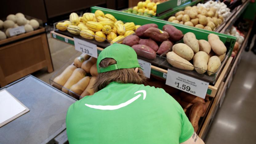 A worker inspects produce during a tour of at an Amazon checkout-free, large format grocery store in Seattle, Washington, U.S. February 21, 2020. Picture taken February 21, 2020.  REUTERS/Jason Redmond