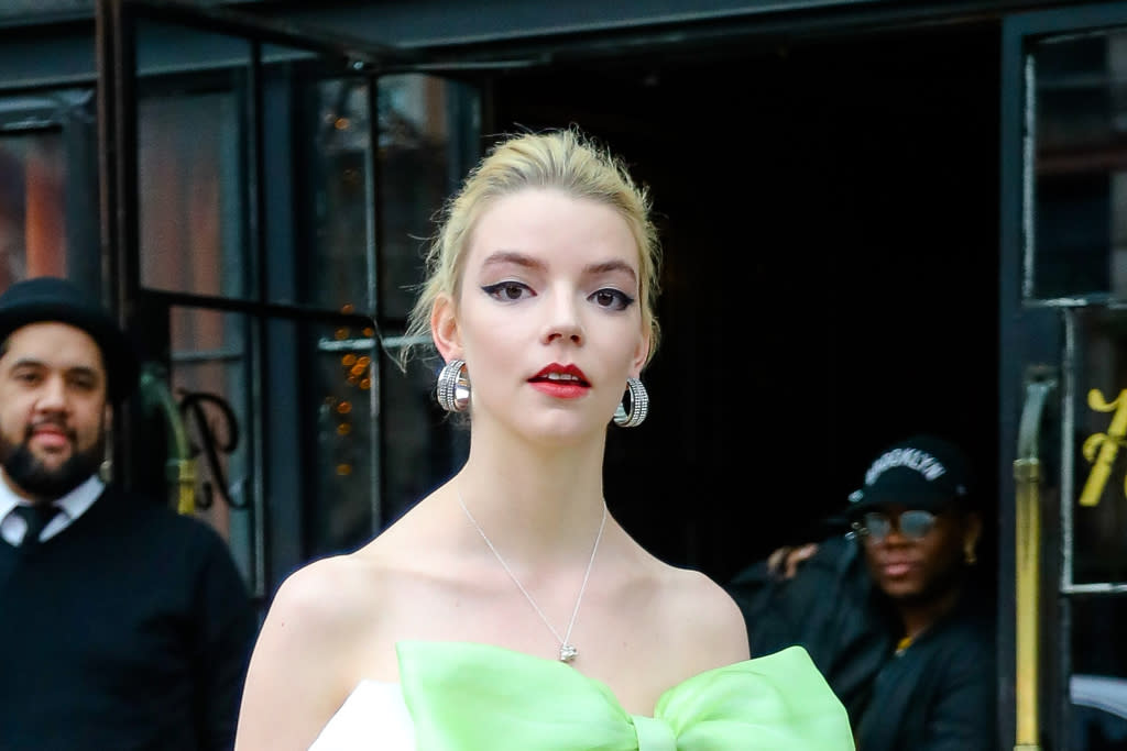 Anya Taylor-Joy transforms herself into a delicate barbie with a mini-dress with lace trim and black high heels for the 2021 SAG Awards