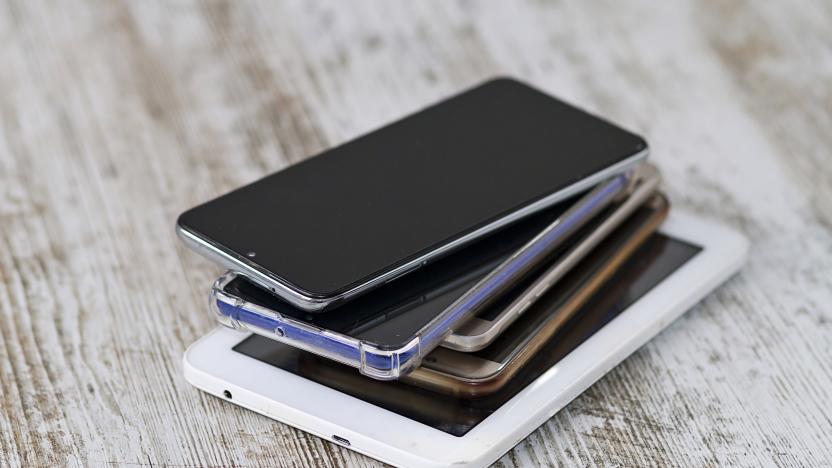 A smartphone pile and its charging and audio cables