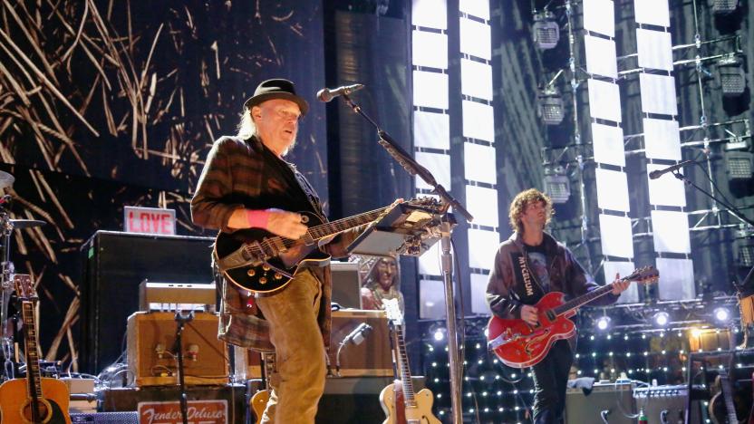 EAST TROY, WISCONSIN - SEPTEMBER 21:  Micah Nelson (R) performs in concert with Neil Young during Farm Aid 34 at Alpine Valley Music Theatre on September 21, 2019 in East Troy, Wisconsin.  (Photo by Gary Miller/Getty Images)