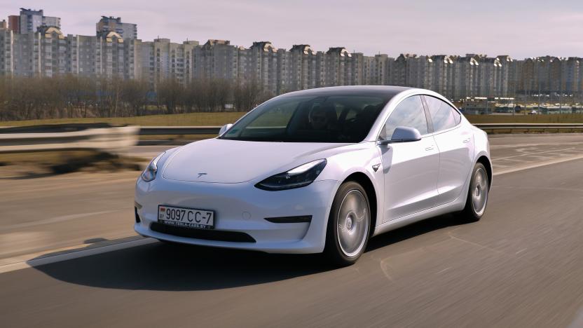 Minsk, Belarus - March 20, 2020: Tesla Model 3 Performance drives on a highway. It has dual motor all-wheel drive, total output is 451 hp. Model 3 is the world's best-selling plug-in electric vehicle.