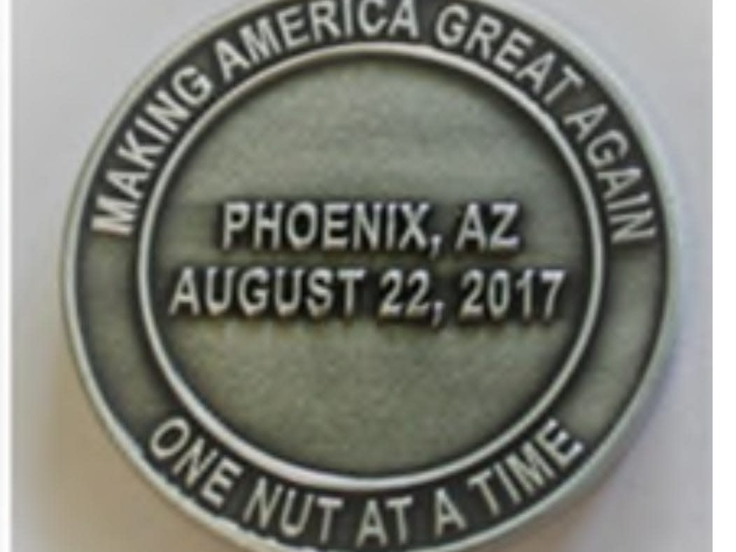 Phoenix police officers passed around a coin to celebrate shooting anti-Trump protesters in the groin. The police chief got a 'written reprimand' for it.