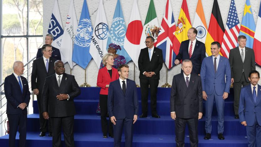 ROME, ITALY - OCTOBER 30: U.S. President Joe Biden, Democratic Republic of Congo's President and African Union Chair Felix Tshisekedi, French President Emmanuel Macron, and Turkey's President Recep Tayyip Erdogan, from row from left, pose with other world leaders for a group photo at the La Nuvola conference center for the G20 summit on October 30, 2021 in Rome, Italy. The G20 (or Group of Twenty) is an intergovernmental forum comprising 19 countries plus the European Union.  It was founded in 1999 in response to several world economic crises. Italy currently holds the Presidency of the G20 and this year's summit will focus on three broad, interconnected pillars of action: People, Planet, Prosperity.  (Photo by Kirsty Wigglesworth - Pool/Getty Images)