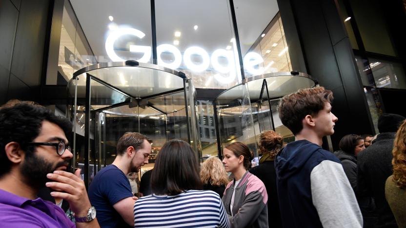 Workers stand outside the Google offices after walking out as part of a global protest over workplace issues, in London, Britain, November 1, 2018. REUTERS/Toby Melville