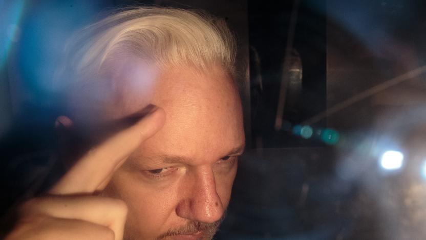 LONDON, ENGLAND - MAY 01: Wikileaks Founder Julian Assange leaves Southwark Crown Court in a security van after being sentenced on May 1, 2019 in London, England. Wikileaks Founder Julian Assange, 47, was sentenced to 50 weeks in prison for breaching his bail conditions when he took refuge in the Ecuadorian Embassy in 2012 to avoid extradition to Sweden over sexual assault allegations, charges he denies. The UK will now decide whether to extradite him to US to face conspiracy charges after his whistle-blowing website Wikileaks published classified US documents. (Photo by Jack Taylor/Getty Images)